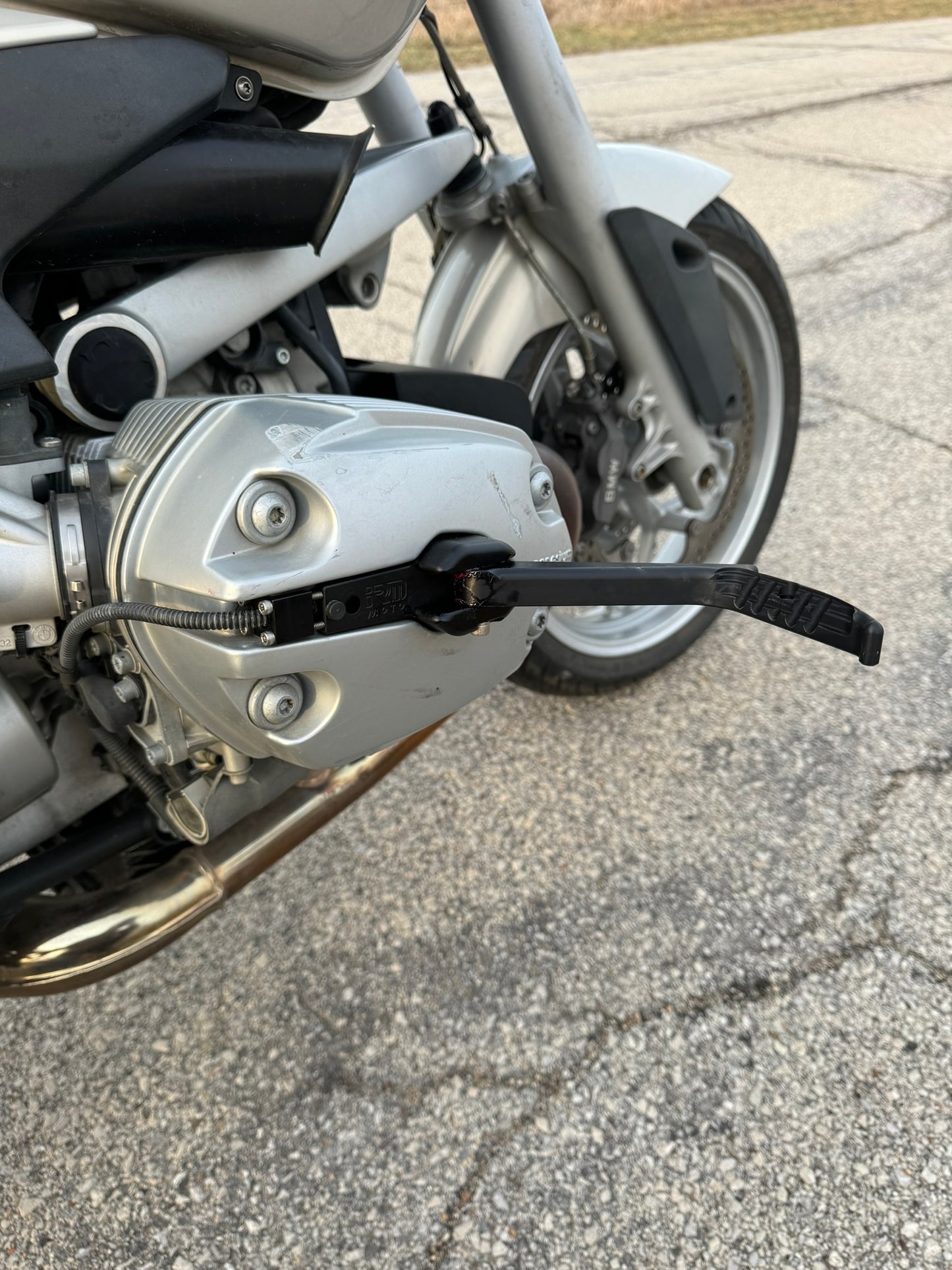 Sleek BMW motorcycle highway pegs. BMW R1200 R highway peg foot rest. 